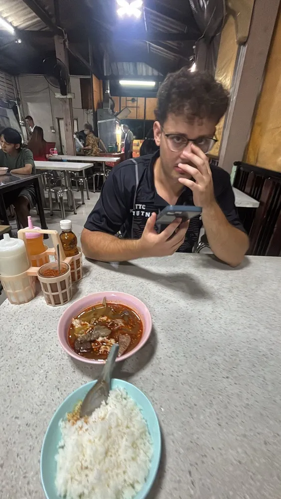 A friend enjoying food at a restaurant
