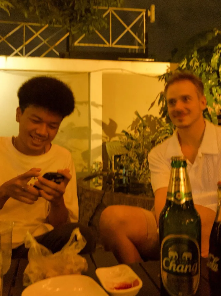 Two friends sharing a relaxed evening at a table